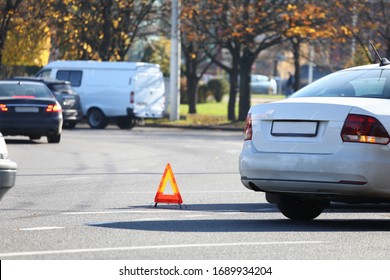 There Is Yellow Triangle Accident Sign On Road. Turn On Emergency Light And Set Emergency Parking Sign. Call Insurance Commissioner And Paperwork. Attraction Lawyer. Make Diagram An Accident