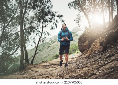 Theres Always So Much More To Capture. Shot Of A Middle Aged Man Taking Pictures With His Camera While Hiking In The Mountains.