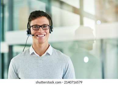 Theres No Query He Cant Handle. Portrait Of A Young Call Center Agent Working In An Office.