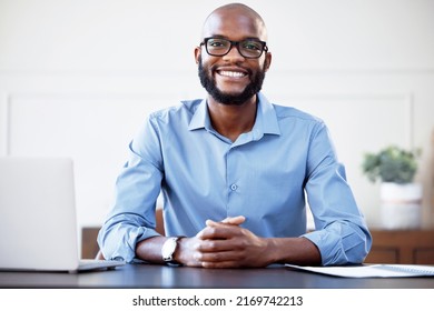 Theres Opportunity In Every Day. Shot Of A Young Businessman Sitting At His Desk.