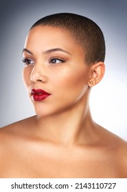 Theres Something About Red Lipstick That Makes Me Feel Empowered. Studio Shot Of A Beautiful Young Woman Posing With A Full Face Of Make-up.