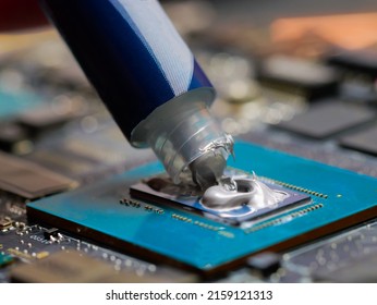 Thermal Grease Paste On Computer Processor Chip. Thermal Compound On On Laptop GPU. Cooling Upgrade Concept.