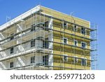 Thermal insulation of the facade of a apartment building with mineral wool plates