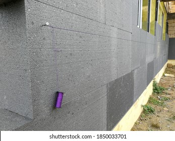 Thermal Insulation With Graphite Polystyrene On The House Wall At The Construction Site