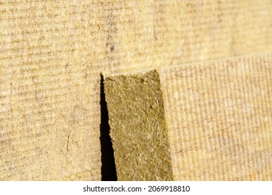 Thermal insulation material, rock wool. Thermal roof insulation layer. Mineral wool or mineral fiber, mineral cotton, mineral fibre, glass wool, MMMF, MMVF. Fiber thermal insulation close-up.