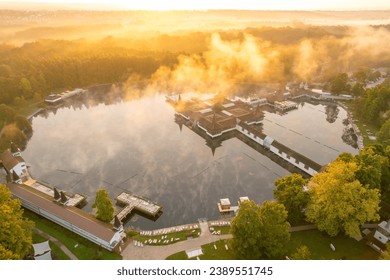 Thermal Lake Heviz at sunrise in Hungary, aerial view. Beautiful lake with thermal water. Popular holiday destination in Hungary. Natural thermal water lake aerial view - Powered by Shutterstock