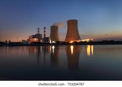 Thermal power plant stack At night - Powered by Shutterstock