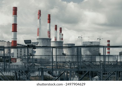 thermal power plant tubes. Industrial factory pollution, smokestack exhaust gases. Climate change global warming concept