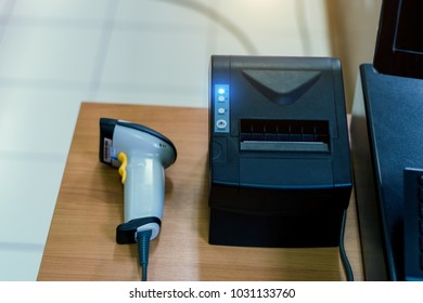 Thermal receipt printer with barcode scanner at counter service in the supermarket.This is for helping to save the sales information and print the receipt with the tax invoice.