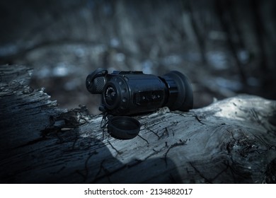 Thermal Vision Monocular On The Background Of The Night Forest.