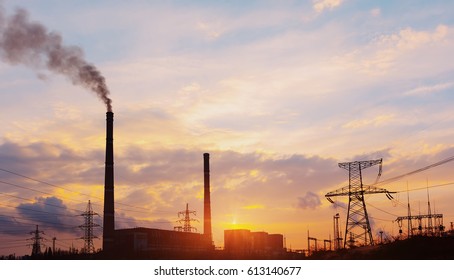 Thermoelectric station generating smokes at the sunset