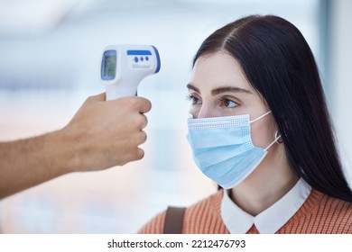 Thermometer, Healthcare And Covid With A Doctor Scan A Patient Temperature With Infrared, Checking For A Fever. Sick Woman With Mask For Corona, Flu Or Cold In Exam Or Consult In A Medical Clinic