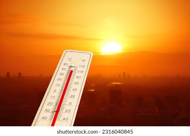 A thermometer and heat wave in a big city - Powered by Shutterstock