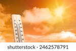 Thermometer with hot temperature with sky background. Environment, global warming, and climate change concept