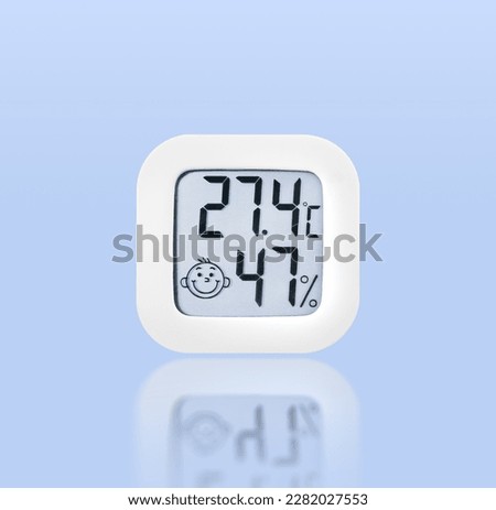 Thermometer and humidity instrument isolated on blue background with reflection, Clipping path included.