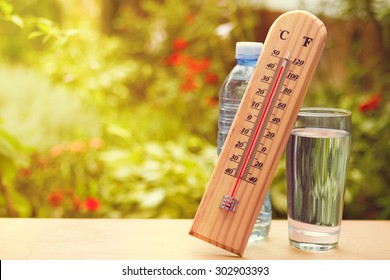 Thermometer On Summer Day Showing High Temperature Near 45 Degrees