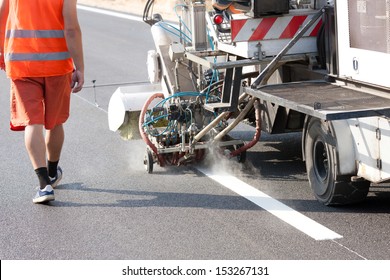 Thermoplastic Spray Marking Machine During Road Construction Works