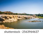 Thermopolis WY USA - August 22, 2017: Layers of mineral deposits border a thermal pool at Hot Springs State Park.