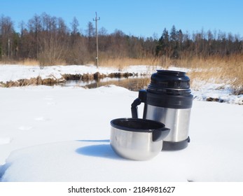 Thermos Of Coffee Standing In The Snow