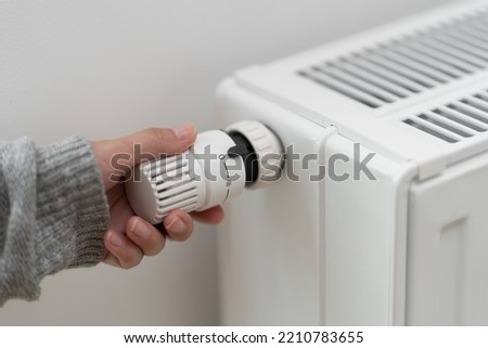 The thermostat controller, which sets the temperature of the heater radiator in the room, is set to the off position. Turning off the heating in the warm season during the energy crisis.