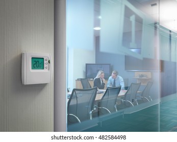 Thermostat Outside Conference Room With Office Workers In Meeting