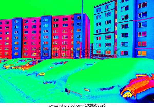 Thermovision scan\
of parking car on lots in houses neighborhood while snow falling\
continuously in winter time \
