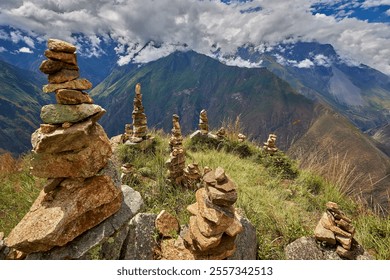 These apachetas, stone cairns built by trekkers, honor the Pachamama (Mother Earth). Each stone represents a moment, a wish, or a blessing left behind on the journey to Choquequirao - Powered by Shutterstock