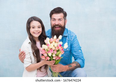 These Flowers Are For You. Father And Daughter With Happy Faces Hug. Spring Holiday Time. Tulip Flowers For Her. Fresh Womens Day Present. Fathers Day. Ready For Mothers Day. Congratulate With Flower.