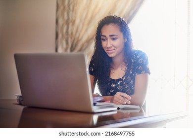 These Online Studying Tips Are Really Helpful. Shot Of A Young Woman Using Her Laptop At Home.