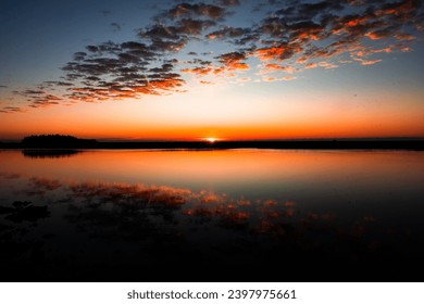 These photos depict sunrise and sunset over the marsh and water in Lowcountry Charleston South Carolina. The exact location is Buck Hall Recreational center and Boat Ramp