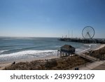 These are photos of a ferris wheel on the Atlantic City boardwalk. 