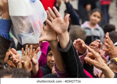 Thessaloniki, Greece - April 2, 2016: Refugees Living In Tents At The Relocation Center Diavata Waiting In Line To Get Food