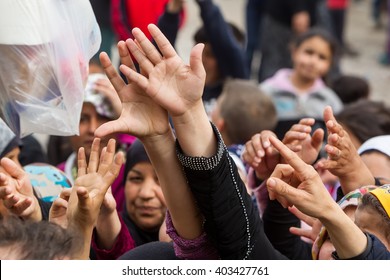 Thessaloniki, Greece - April 2, 2016: Refugees Living In Tents At The Relocation Center Diavata Waiting In Line To Get Food