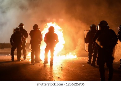 Thessaloniki, Greece - Nov 17,2018: petrol bomb explodes among riot policemen during clashes after the rally marking the 45th anniversary of the 1973 student uprising against the military dictatorship