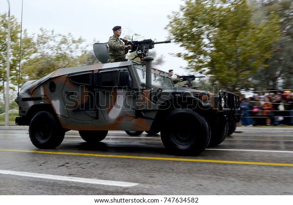 Thessaloniki, Greece - October 28, 2017. A Humvee\
vehicle of the Greek Army photographed with panning technique,\
during the annual military parade, commemorating the entrance of\
Greece in WWII.
