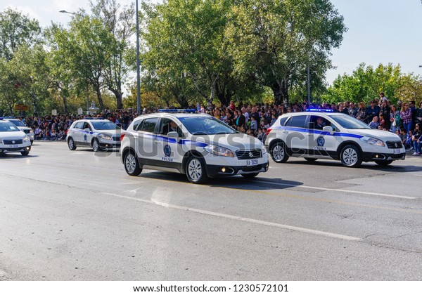 Thessaloniki, Greece - October 28 2018: Hellenic\
Police cars during Oxi Day parade. Greek police - Ellinikii\
Astynomia Security forces vehicles with personnel at national day\
celebration\
parade.