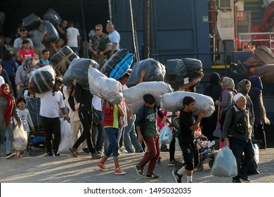 Thessaloniki, Greece – Sept 2, 2019: Refugees and migrants disembark to the port of Thessaloniki after being transfered from the refugee camp of Moria, Lesvos island.
