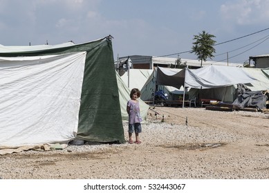 Thessaloniki, Greece - September 13, 2016. A Refugee Girl Stands Outside A Tent Inside A Refugee Camp Near The Northern Greek City Of Thessaloniki.