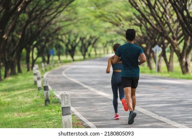 They Are An Asian Couple Jogging And Exercising.