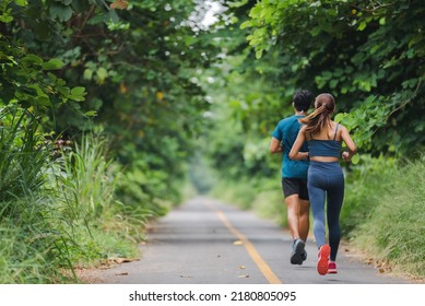 They Are An Asian Couple Jogging And Exercising.