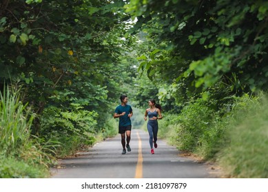 They Are An Asian Couple Jogging And Exercising.