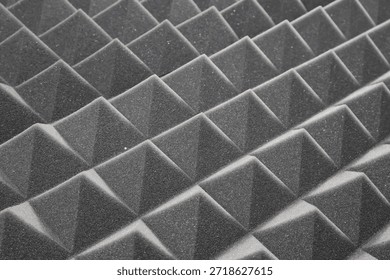 They are essential for reducing echoes and background noise by trapping sound waves between the foam peaks