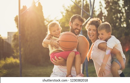 They Have The Most Fun As A Family. Family On Basketball Court.