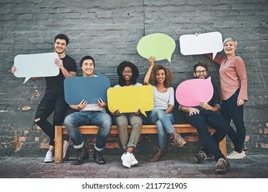 They Putting Their Opinions Out There. Shot Of A Diverse Group Of People Holding Up Speech Bubbles Outside.