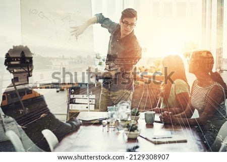 They are right on track. Multiple exposure shot of a business group superimposed over a train track.
