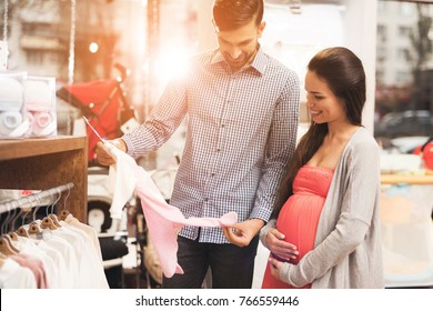 They together came for shopping in the shopping center. They are preparing to become parents and choose things for their future child. - Powered by Shutterstock