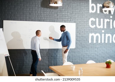 Theyre Goal And Detail Oriented. Shot Of Two Businessmen Having A Discussion In The Boardroom.