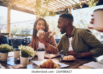 Theyre in the honeymoon stage of their relationship. Cropped shot of a happy young couple out for lunch at a cafe. - Powered by Shutterstock