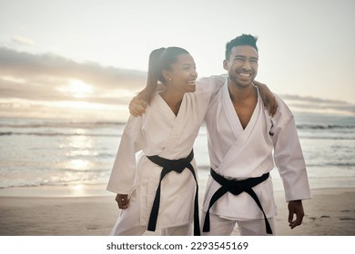 Theyre a kick karate couple. Shot of two young martial artists practicing karate on the beach. - Powered by Shutterstock