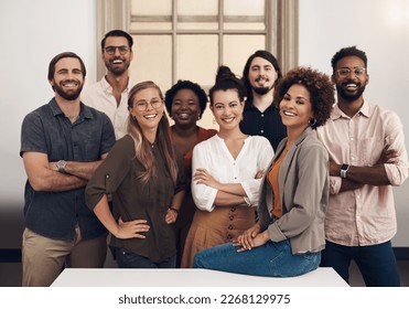 Theyre ready to push towards success with tenacity and confidence. Portrait of a group of businesspeople standing together in an office. - Shutterstock ID 2268129975